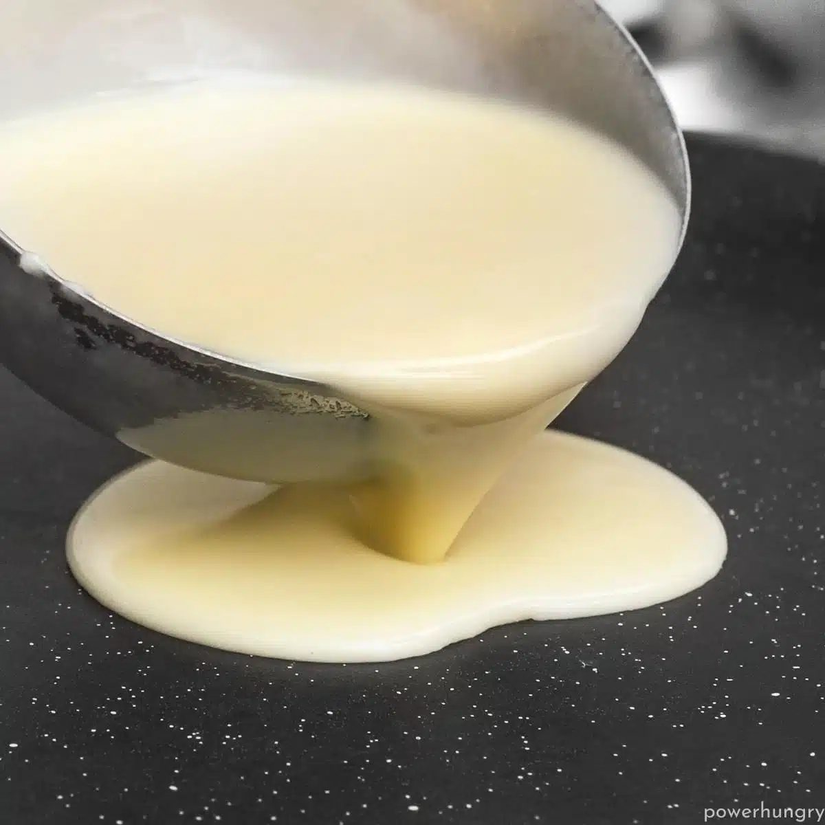 amaranth tortilla batter getting poured onto a nonstick skillet