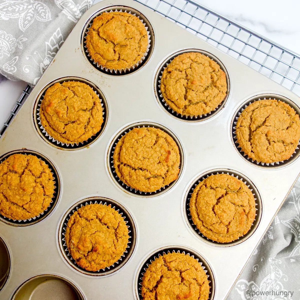 baked applesauce chickpea flour muffins in muffin tin