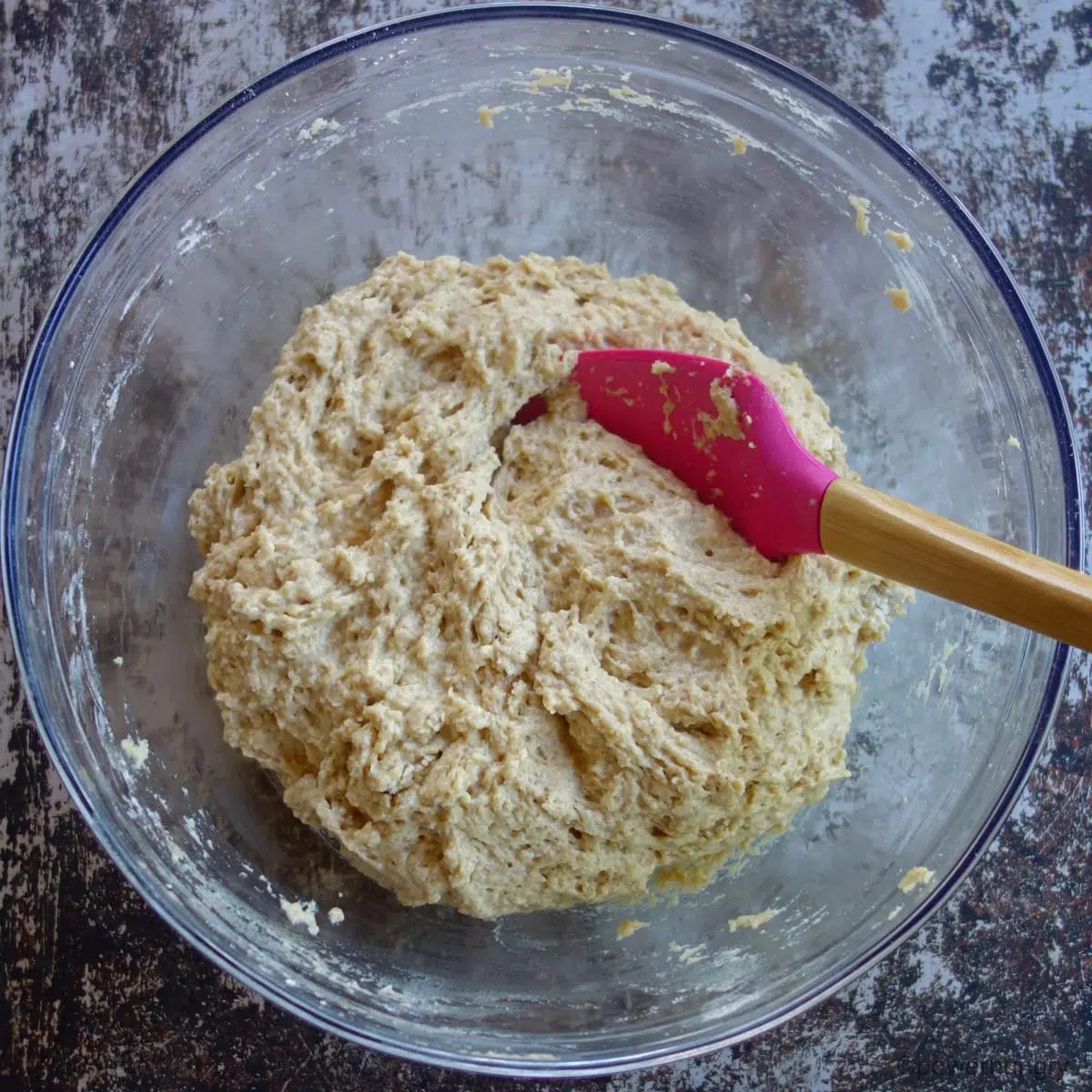 applesauce millet bread batter in a glass bowl