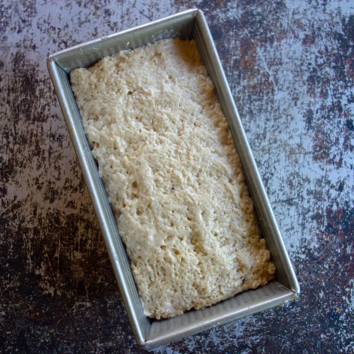 applesauce millet bread batter in a pan