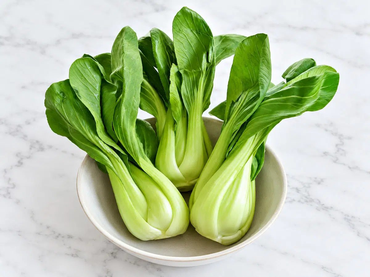 baby bok choy in a stoneware bowl