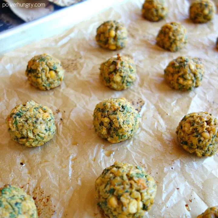 baked split pea meatballs on a baking sheet lined with parchment paper
