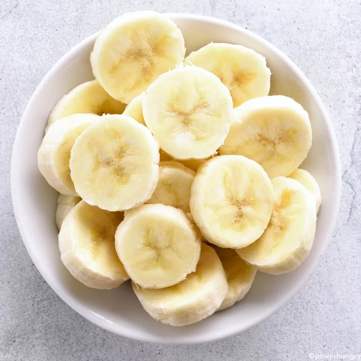 sliced bananas in a white bowl