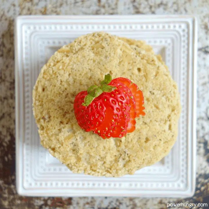 overhead shot of vegan oat pancakes with a strawberry