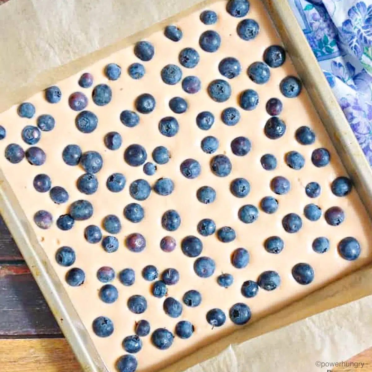 lentil bread batter in a pan with blueberries