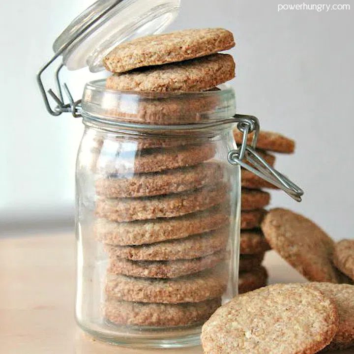 buckwheat almond shortbread stacked in a glass storage jar