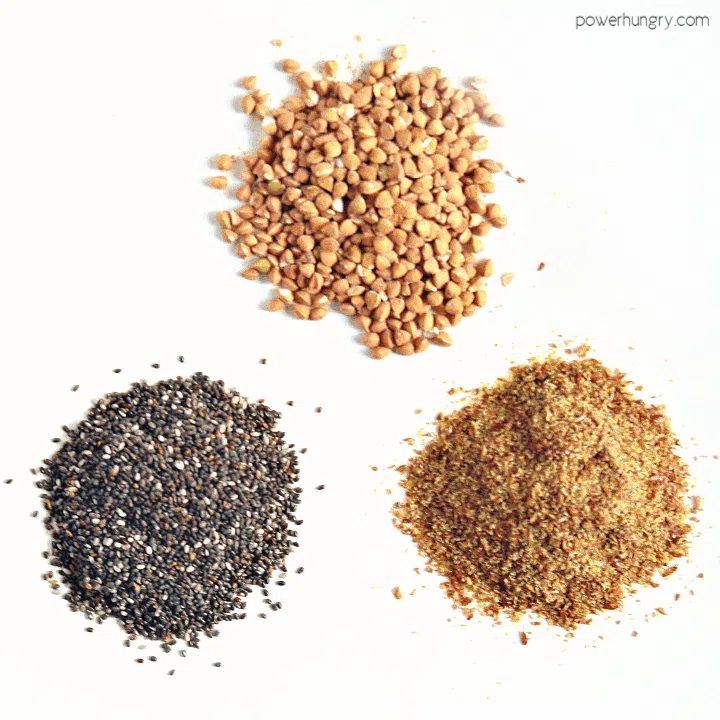 overhead shot of 3 piles of ingredients, chia, buckwheat groats and flaxseed meal