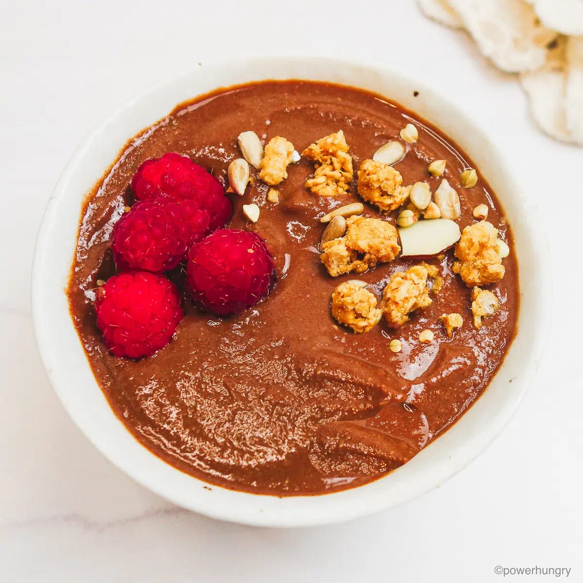 pudding topped with berries and granola