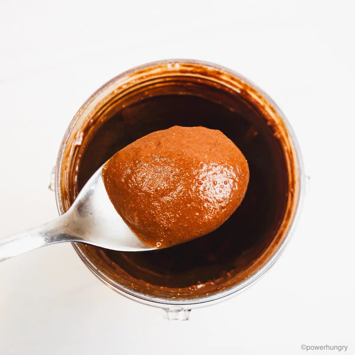 spoon lifting up the blended buckwheat chocolate pudding