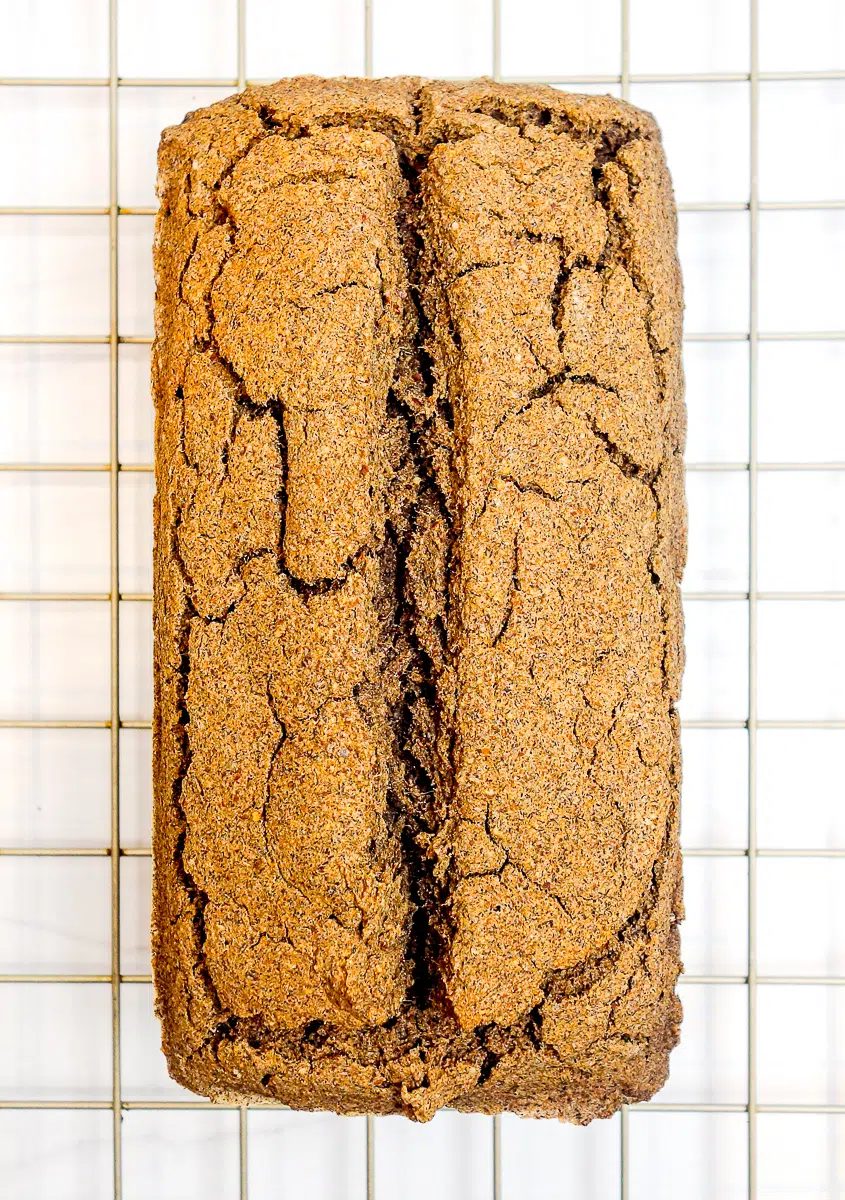 buckwheat bread, removed from pan, on gold cooling rack
