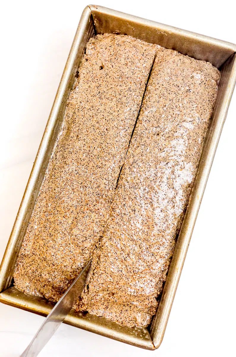 slashed buckwheat bread dough in pan