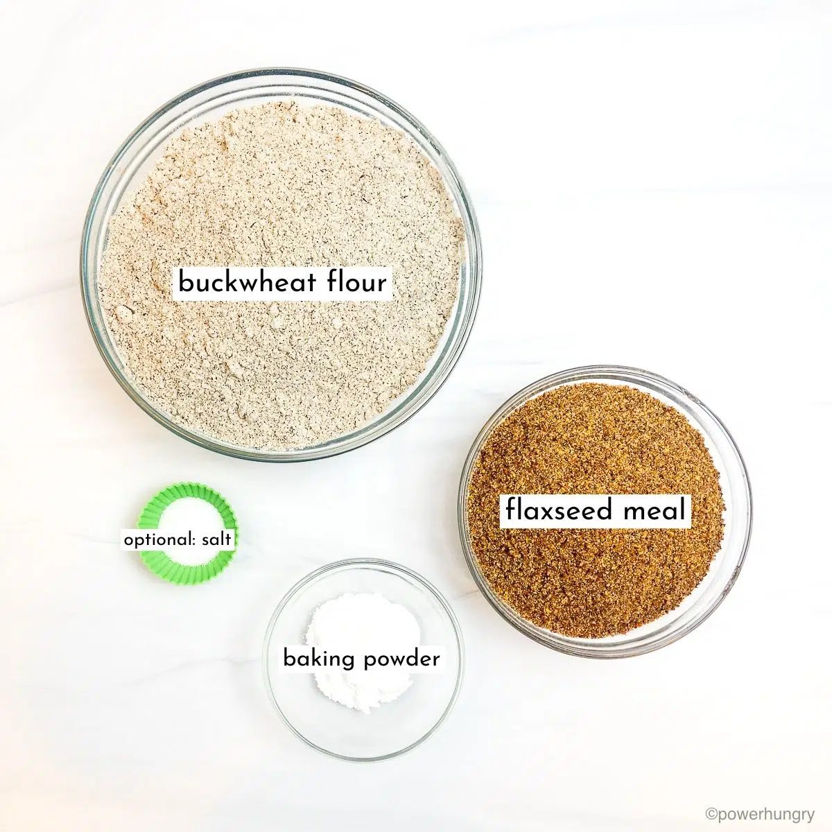 glass bowls filled with the ingredients for buckwheat flour bread