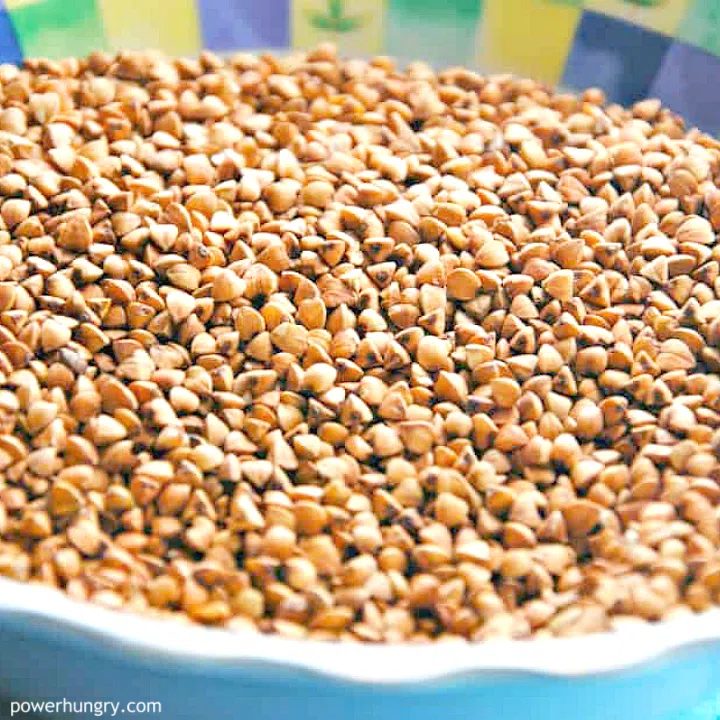 colorful bowl filled with raw buckwheat groats