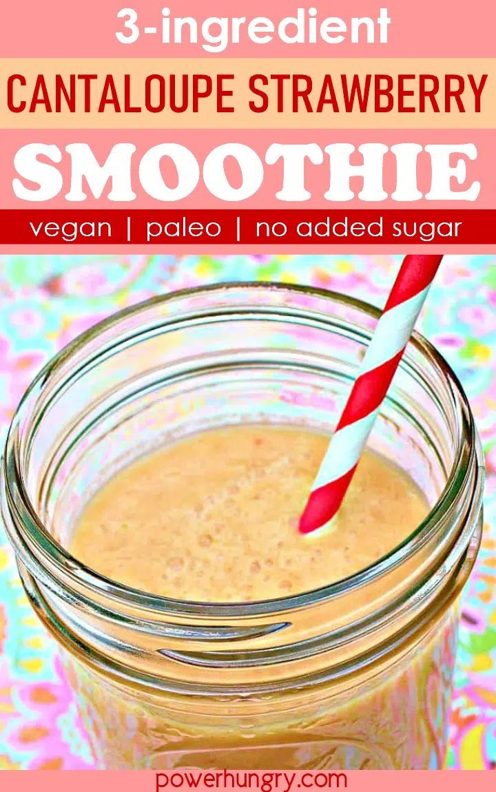 cantaloupe strawberry smoothie in glass with straw