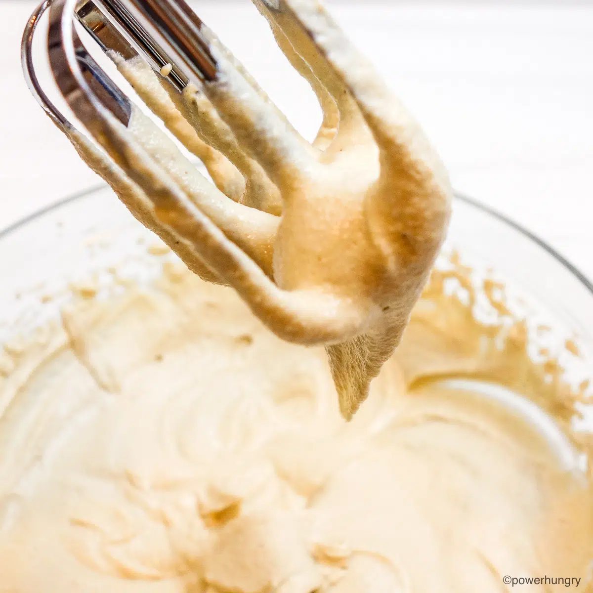 cashew whipped cream clinging to electric beaters