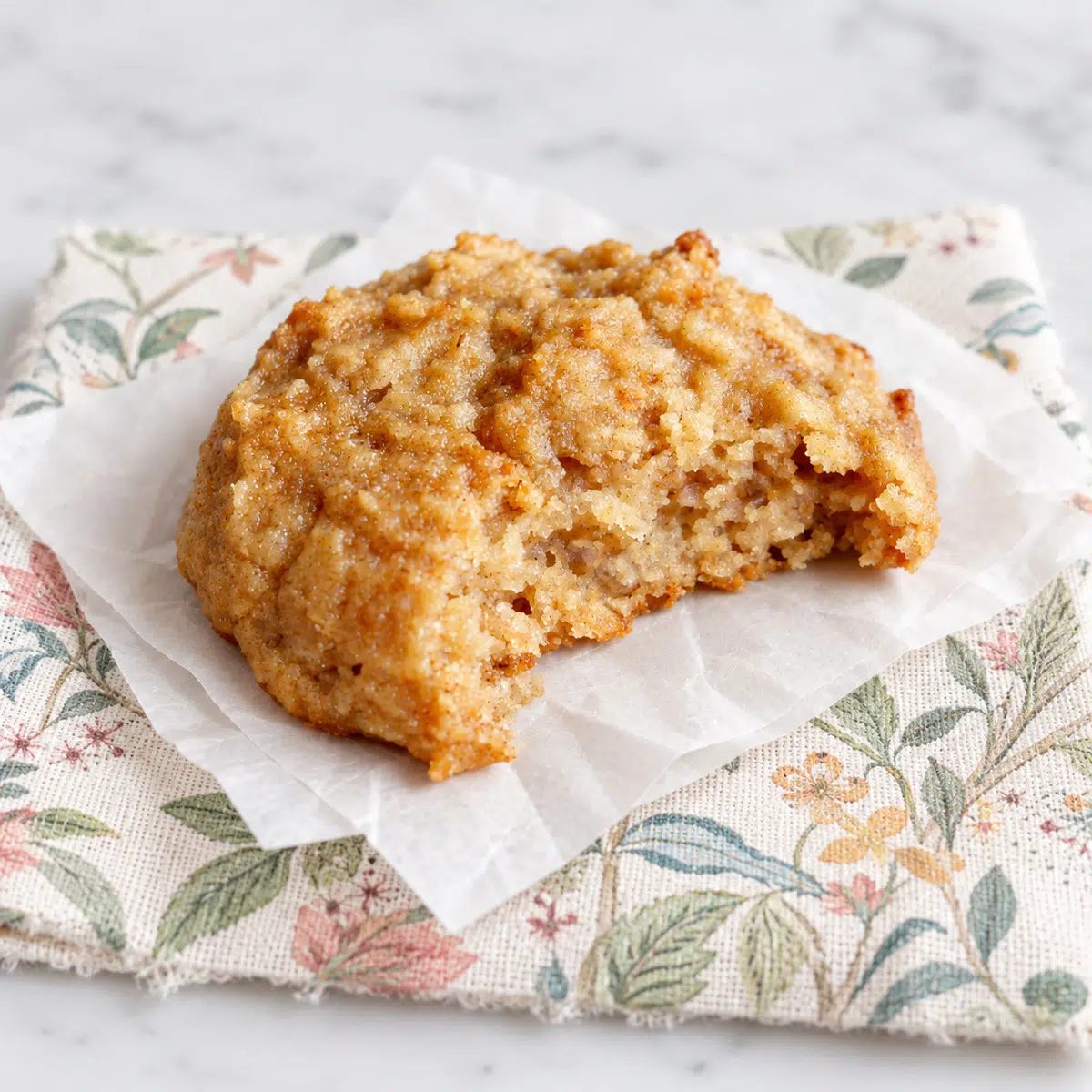 a single cassava flour cookie with a bite taken out