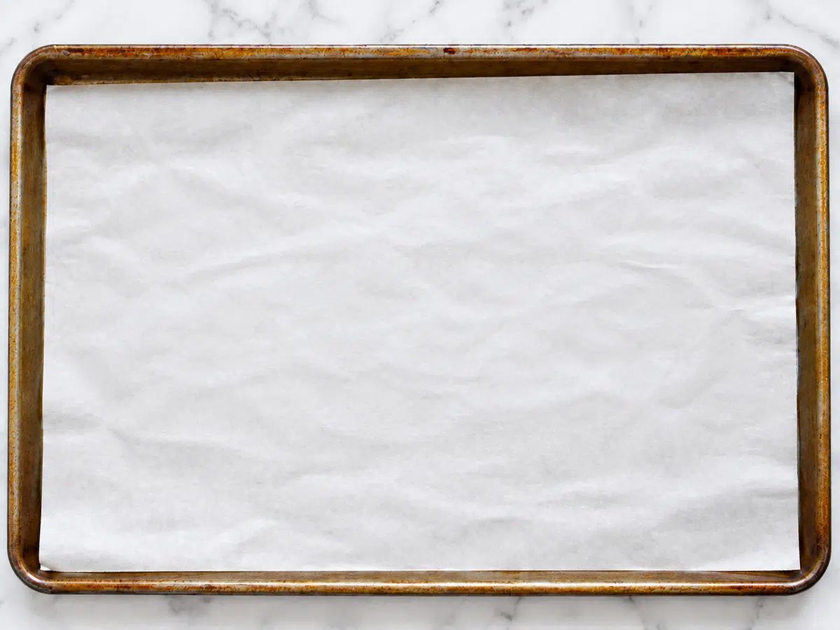baking sheet lined with white parchment paper
