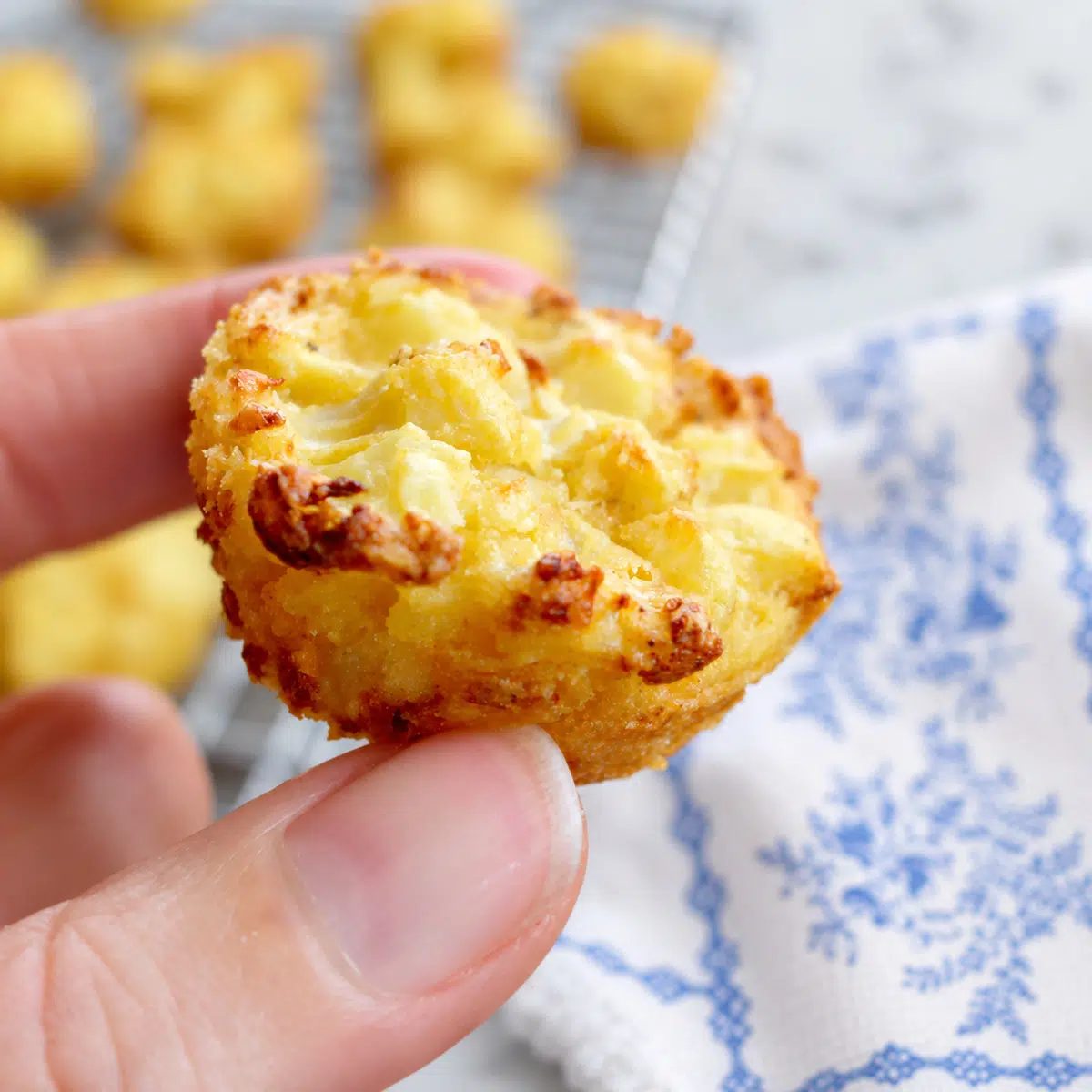 handheld cauliflower cheese bite