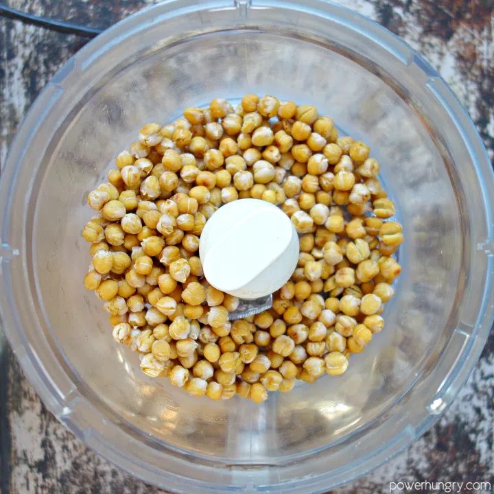 baked chickpeas in a food processor bowl, shortly before being blitzed into crumbs