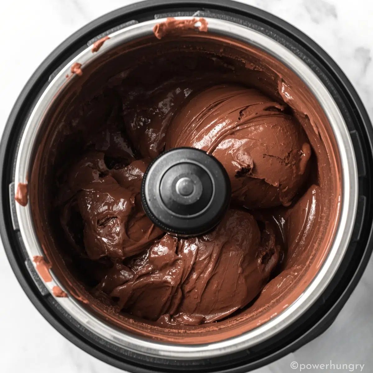 chickpea chocolate ice cream churning in an ice cream maker
