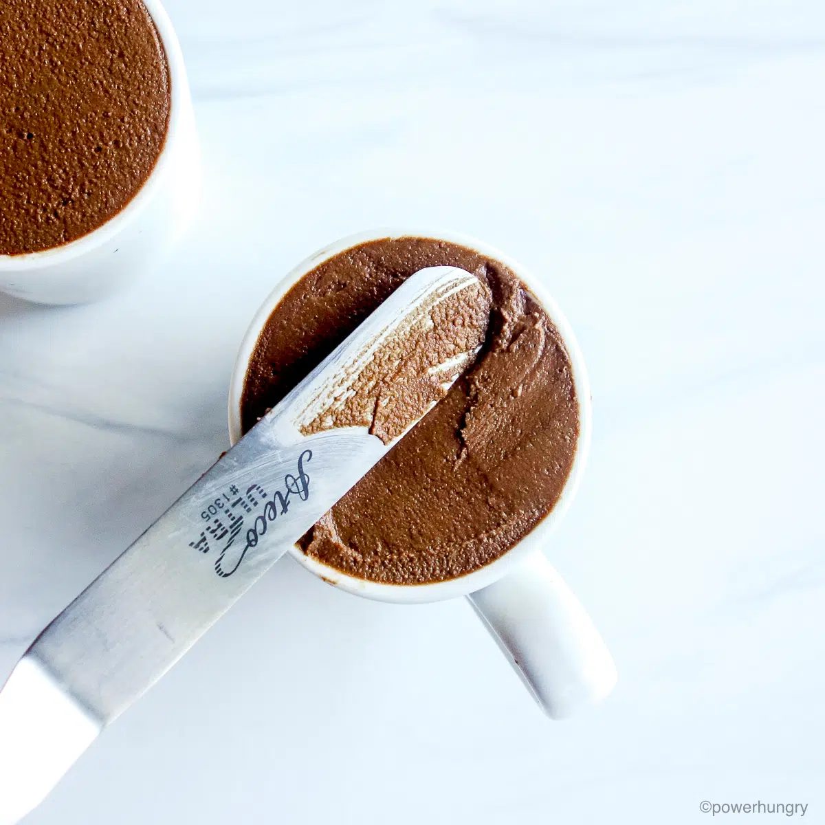 mousse in white espresso cups with tops leveled off