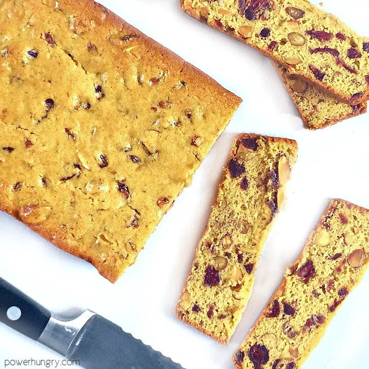 vegan chickpea flour biscotti thins being sliced off of a larger laof
