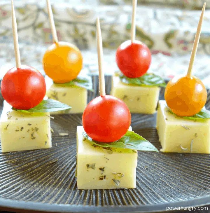 chickpea flour cheddar cheese on toothpicks with cherry tomatoes