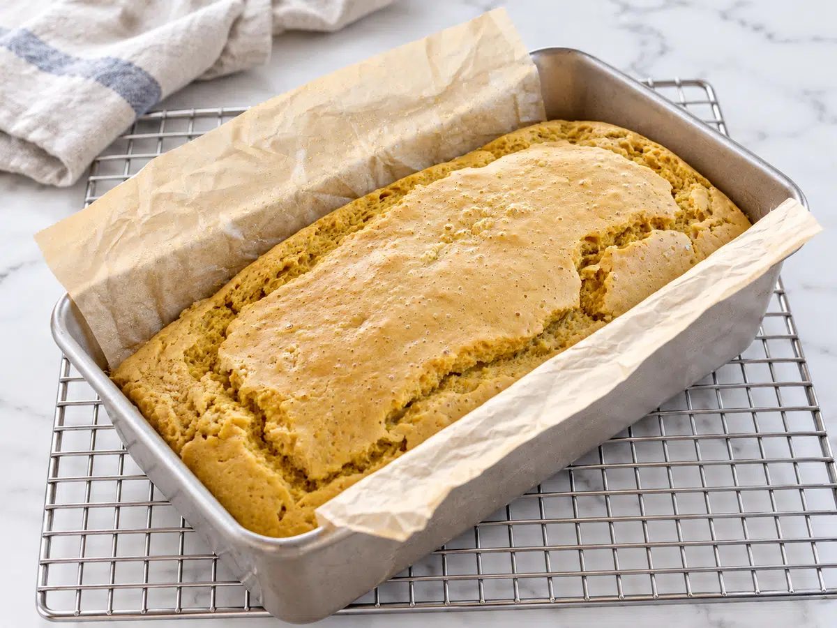 baked loaf of chickpea flour bread in pan