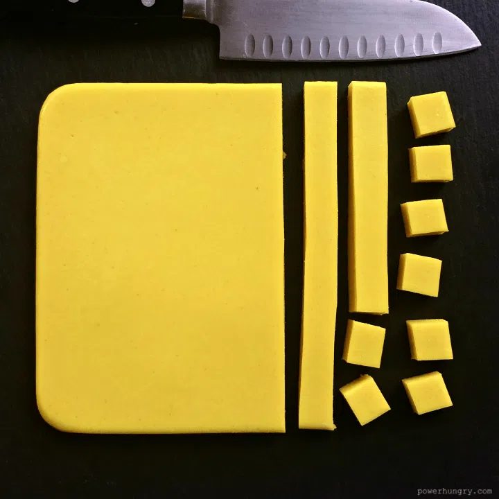 slab of kitchen-made tofu made with chickpea flour (Burmese tofu) on a piece of slate
