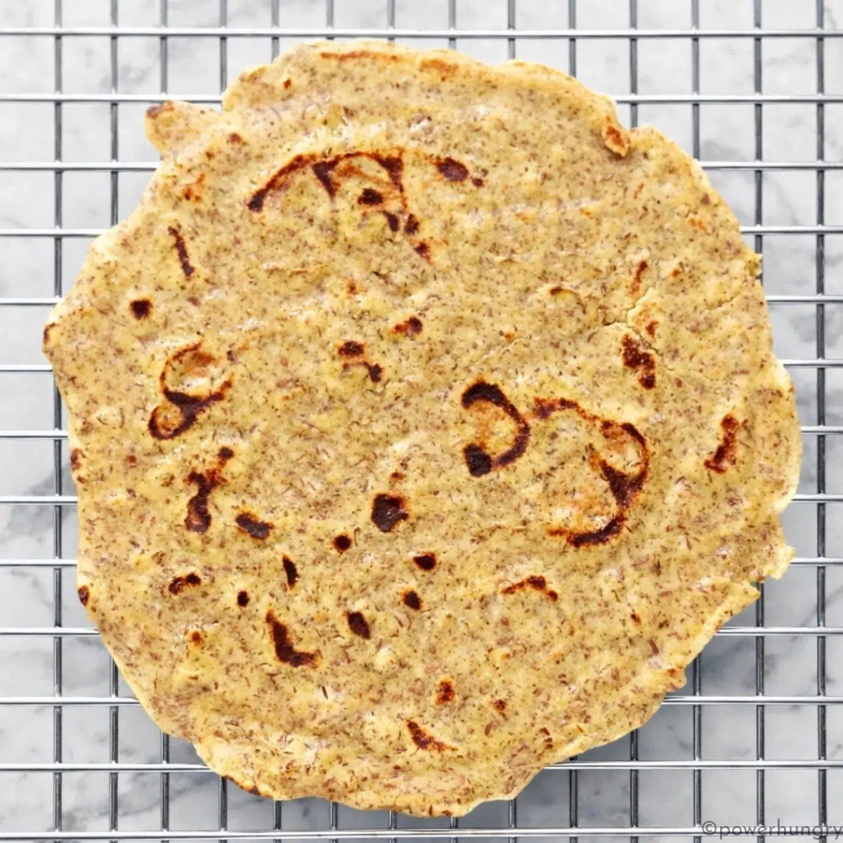 chickpea flour tortilla on a cooling rack