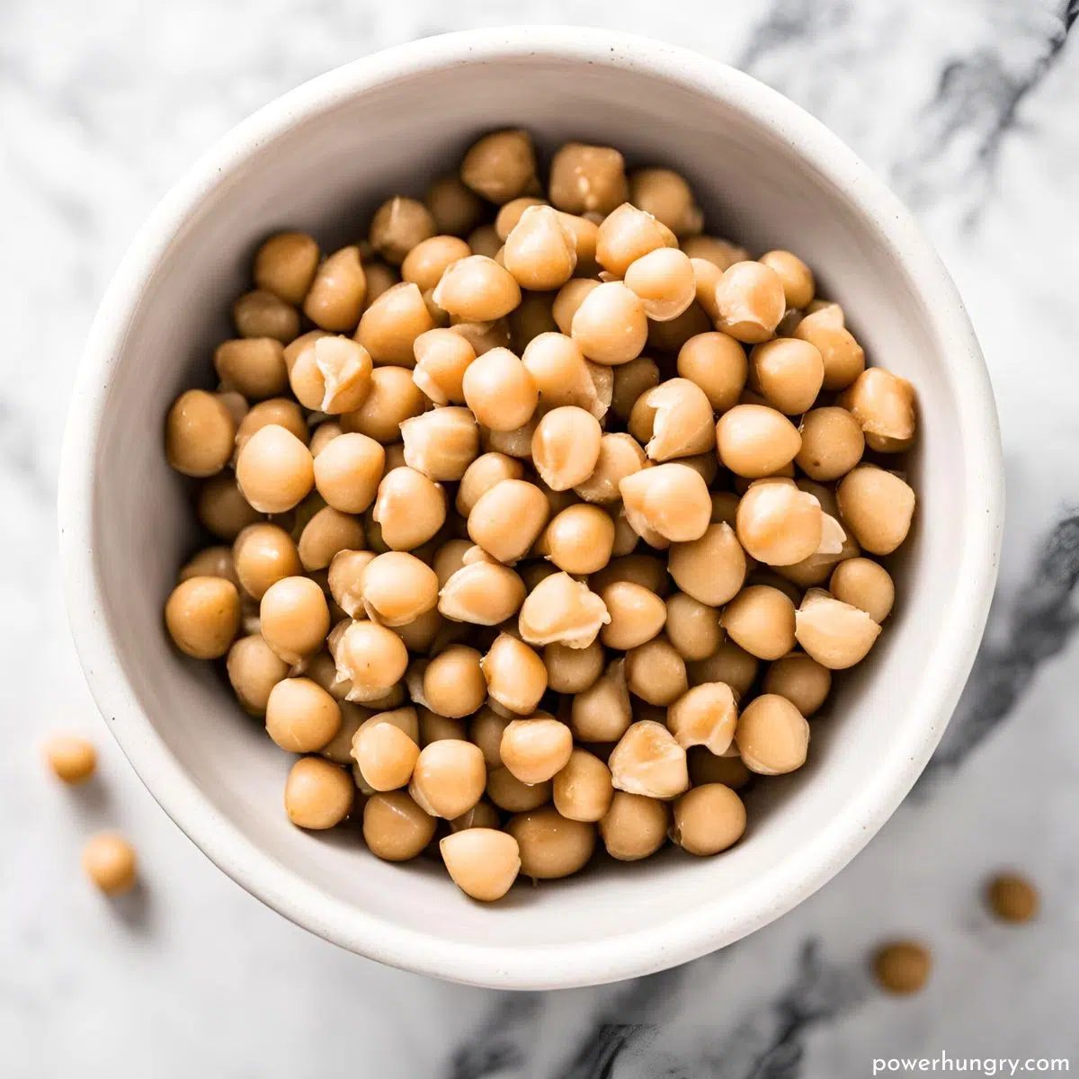 overhead shot of chickpeas in a white bowl