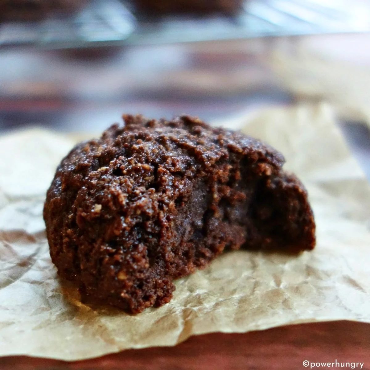 chocolate almond flour cookie with a bite taken out showing interior