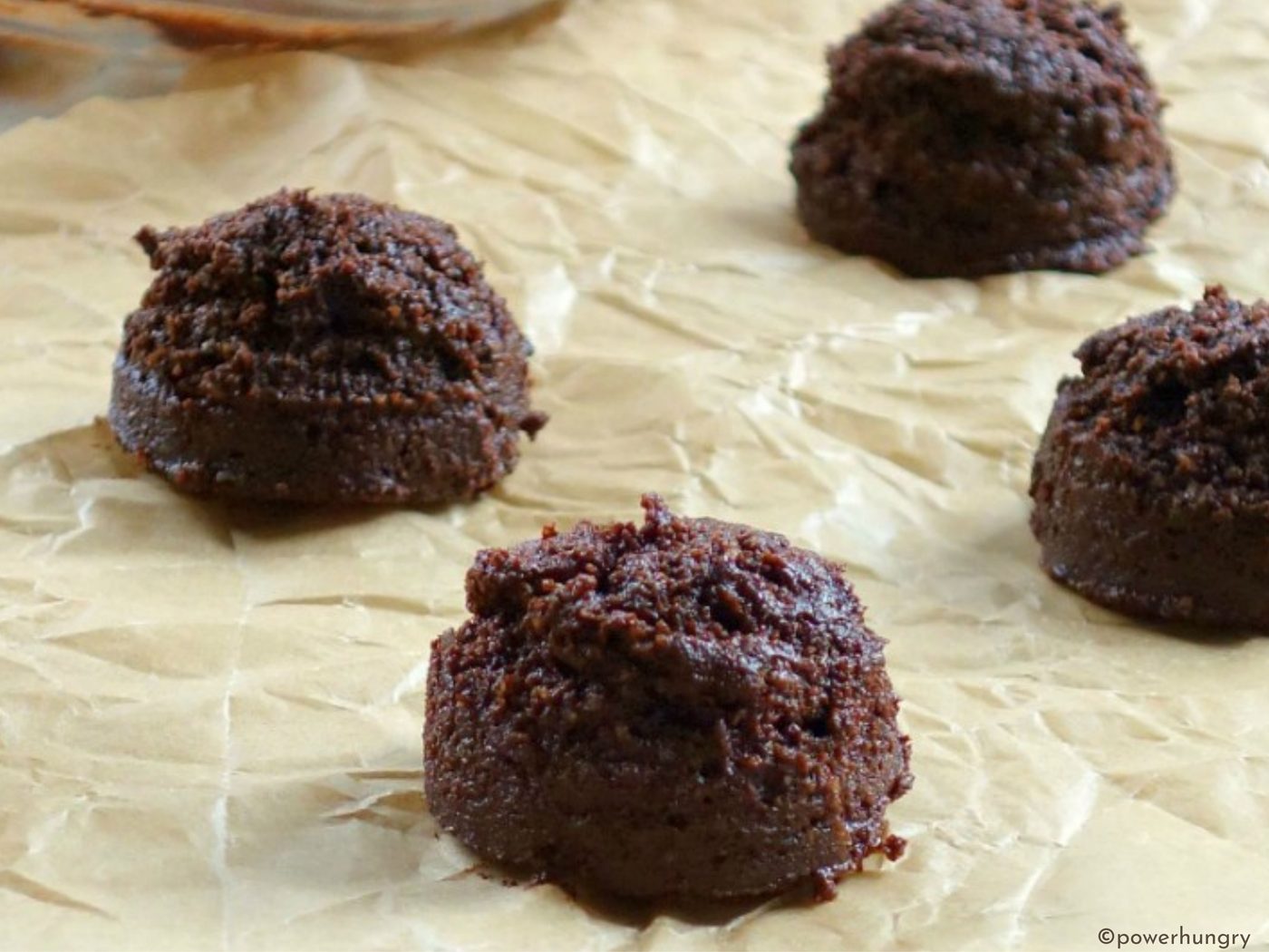 unbaked cookie dough mounds on baking sheet