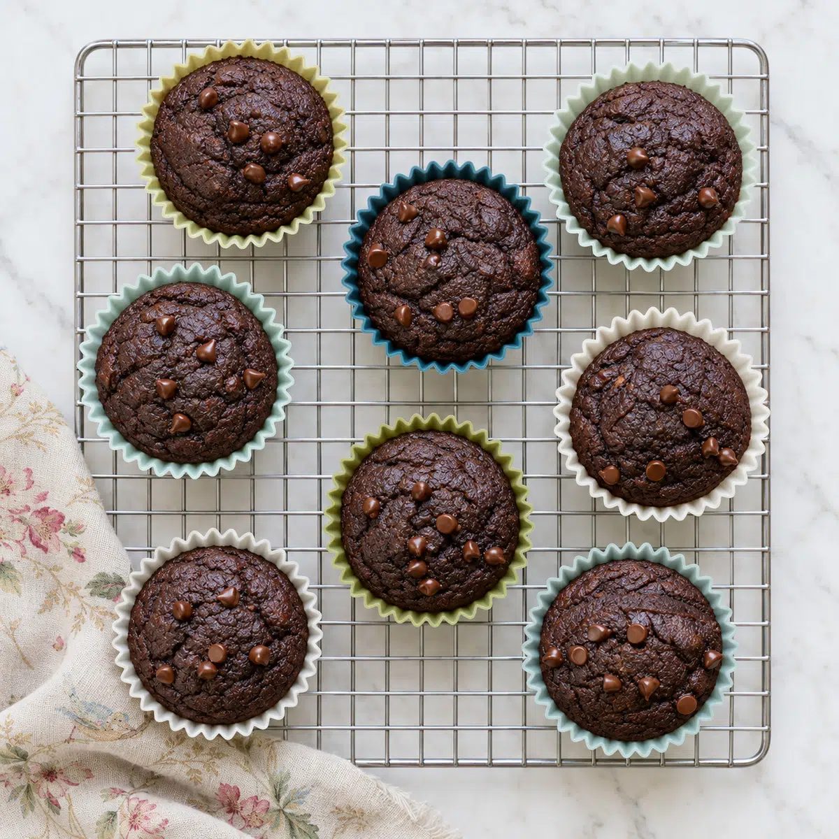 vegan chocolate buckwheat muffins cooling on a cooling rack
