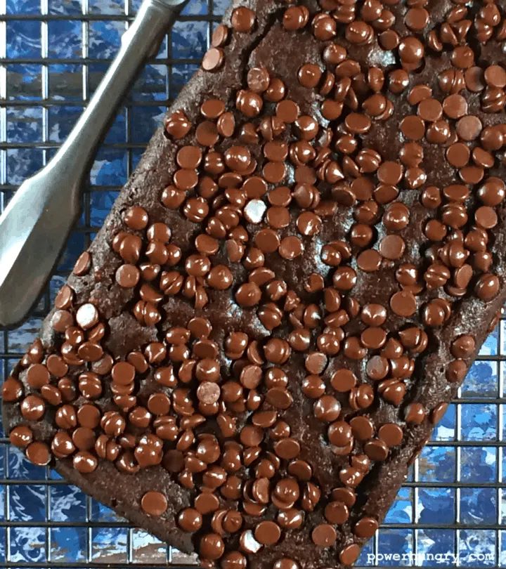 chocolate chickpea flour banana bread on a wire cooling rack