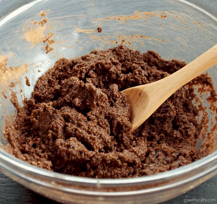 glass bowl filled with chocolate coconut flour cookie dough