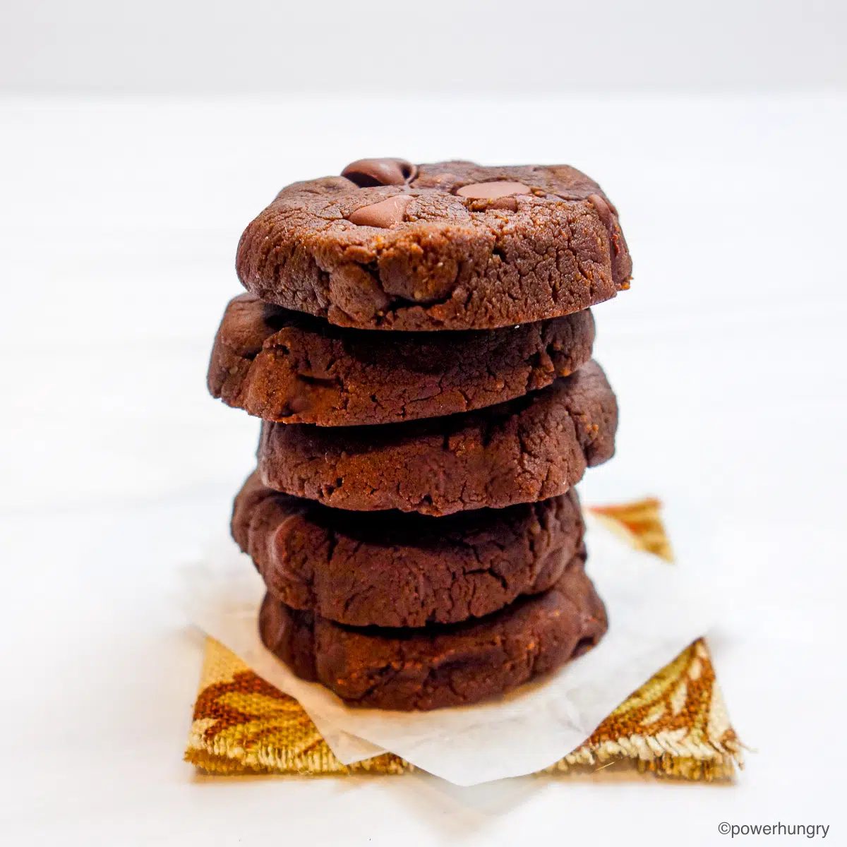 a stack of 5 chickpea flour chocolate cookies