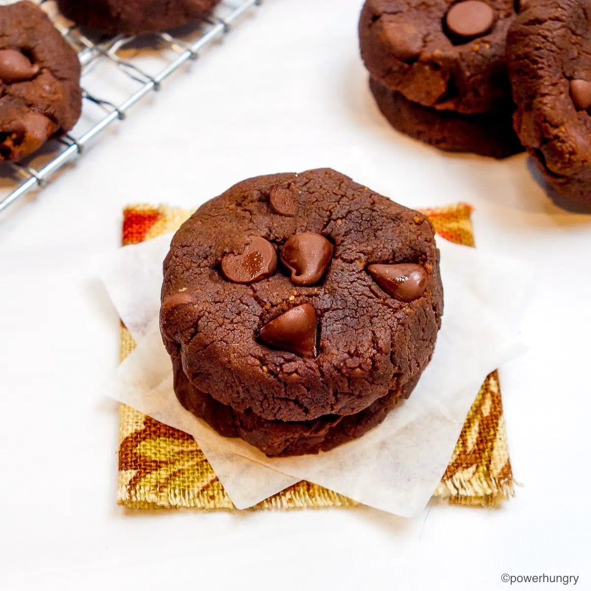a stack of two chocolate peanut butter chickpea flour cookies