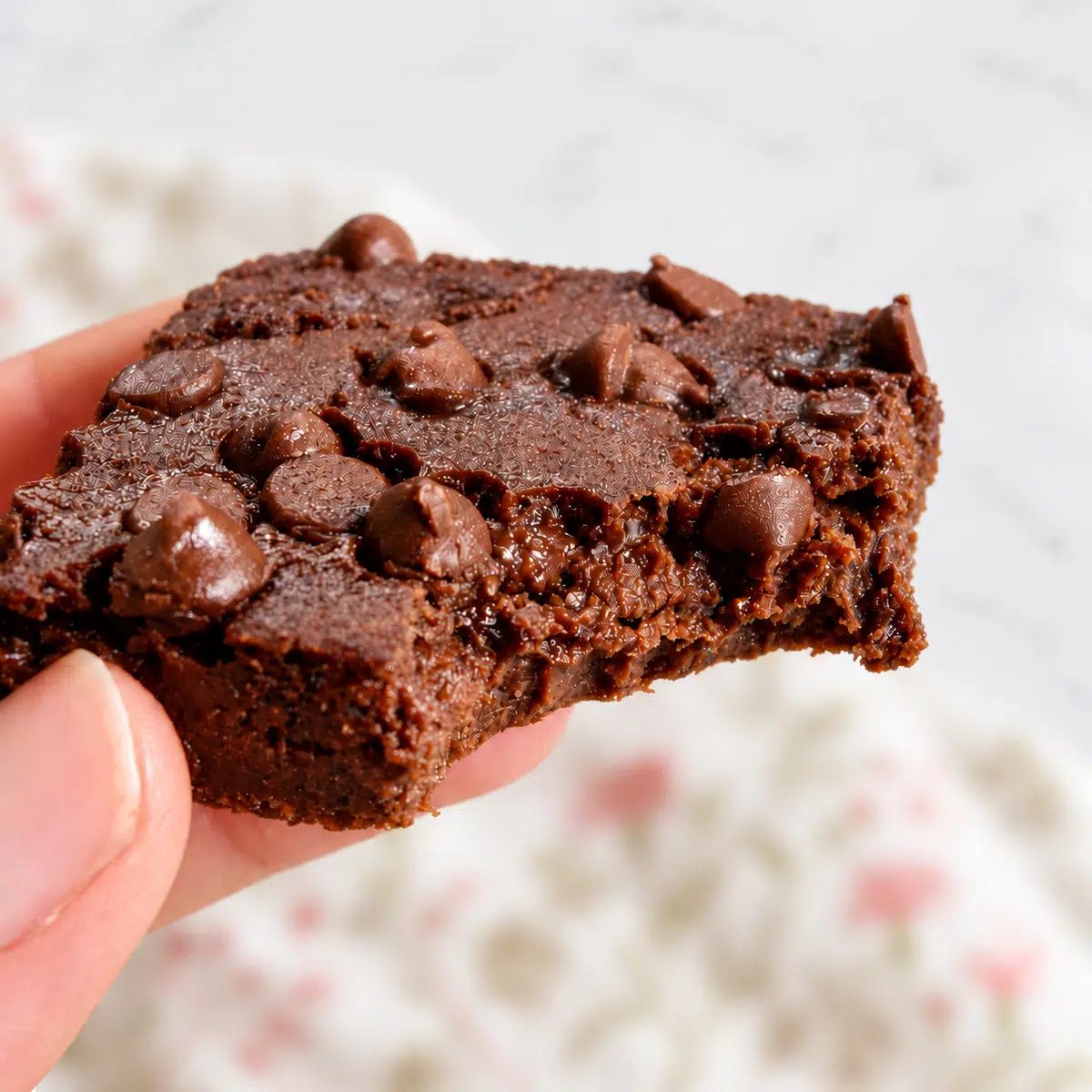 closeup up of vegan low calorie brownie with bite taken out