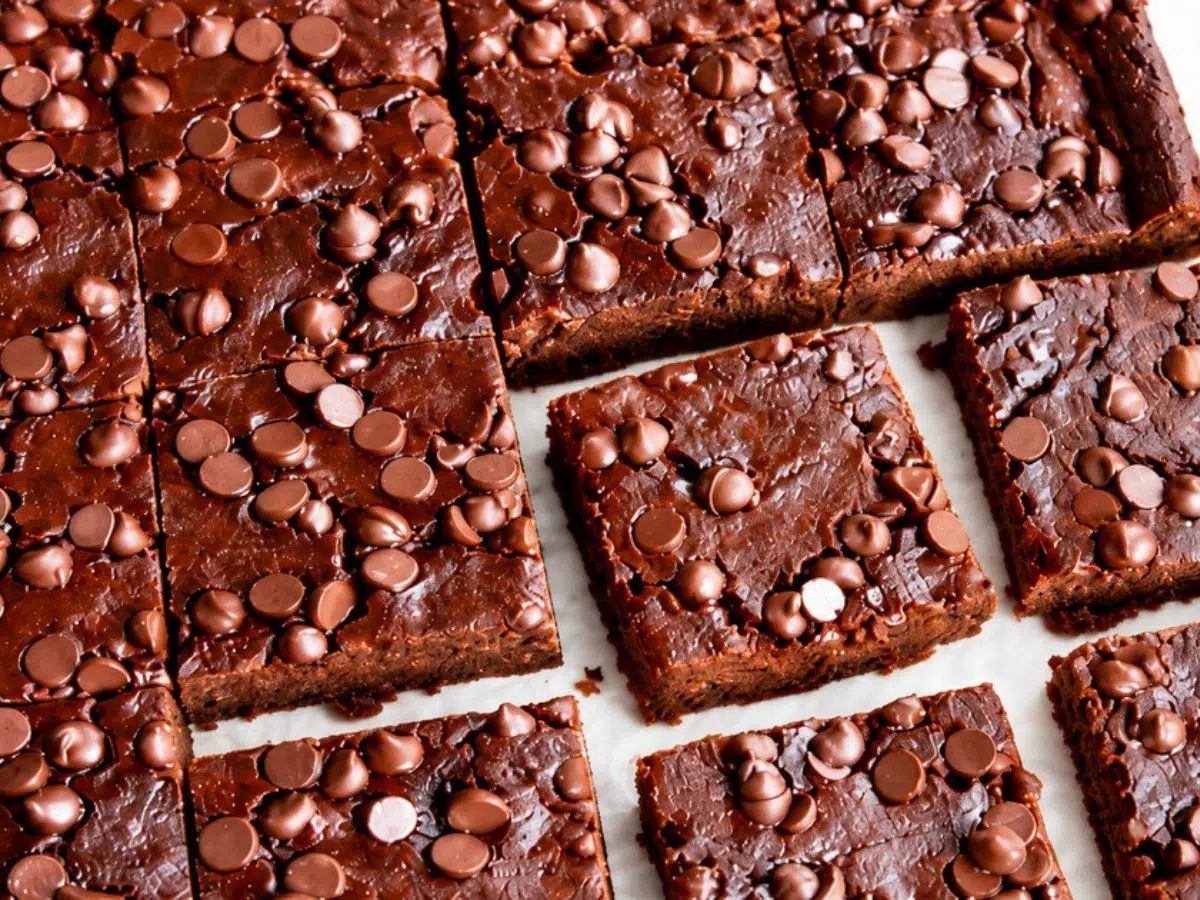 cut vegan low calorie brownies on parchment paper