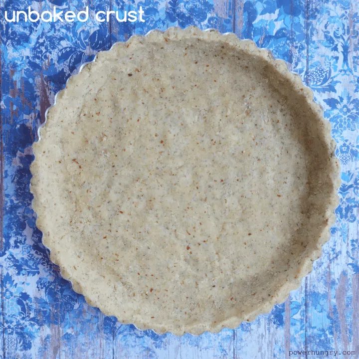 unbaked coconut flour-almond flour pie crust on a blue background