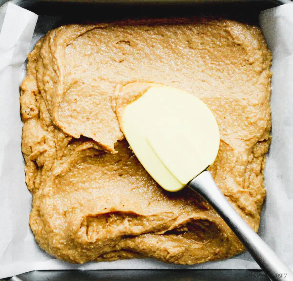 blondie batter being spread in pan