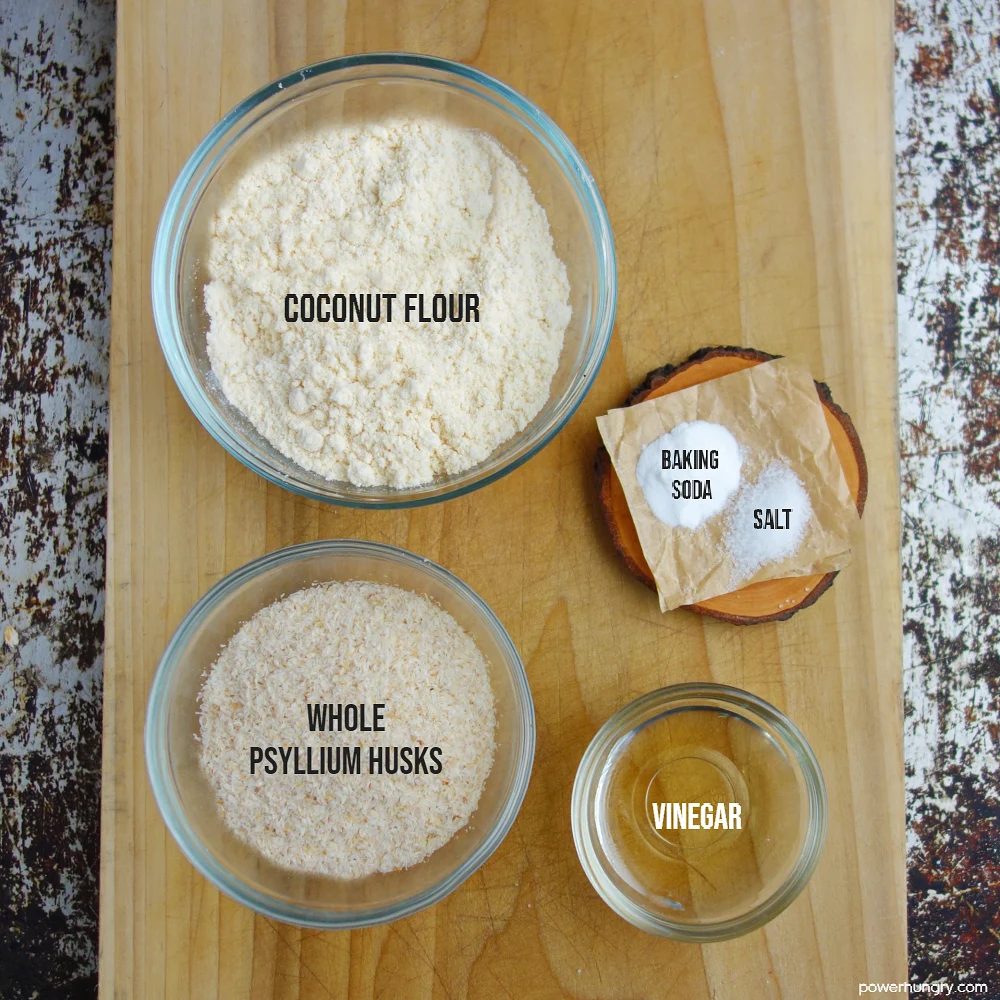 ingredients for coconut bread on a wooden cutting board