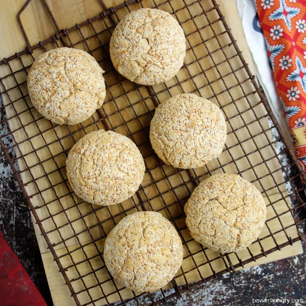 6 coconut flour rolls on an antique cooling rack