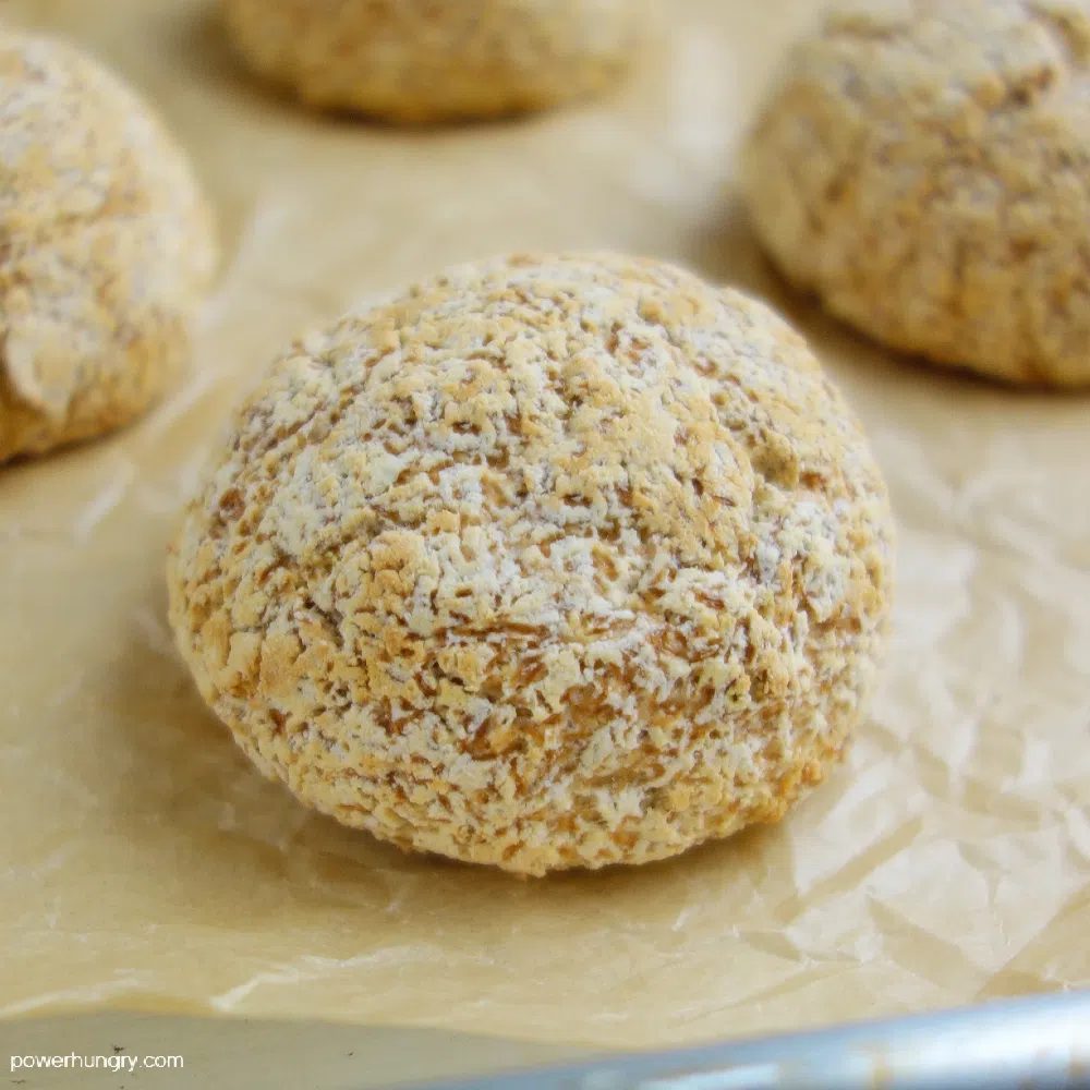 close up of baked coconut flour roll on a parchment paper lined baking sheet