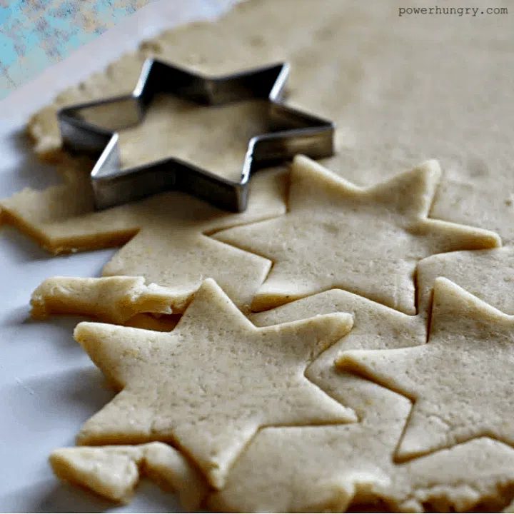 rolled out coconut flour cookie dough , cut out with several star cutters