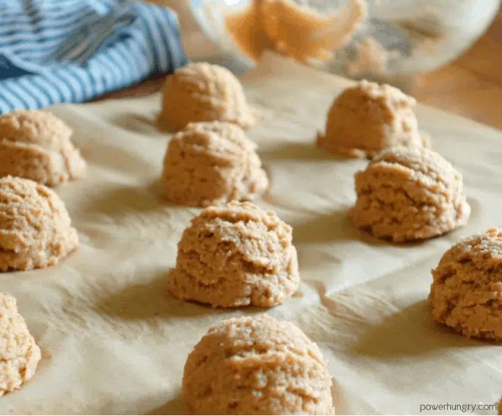 unbaked cookies, made of lentils, on a parchment lined baking sheet