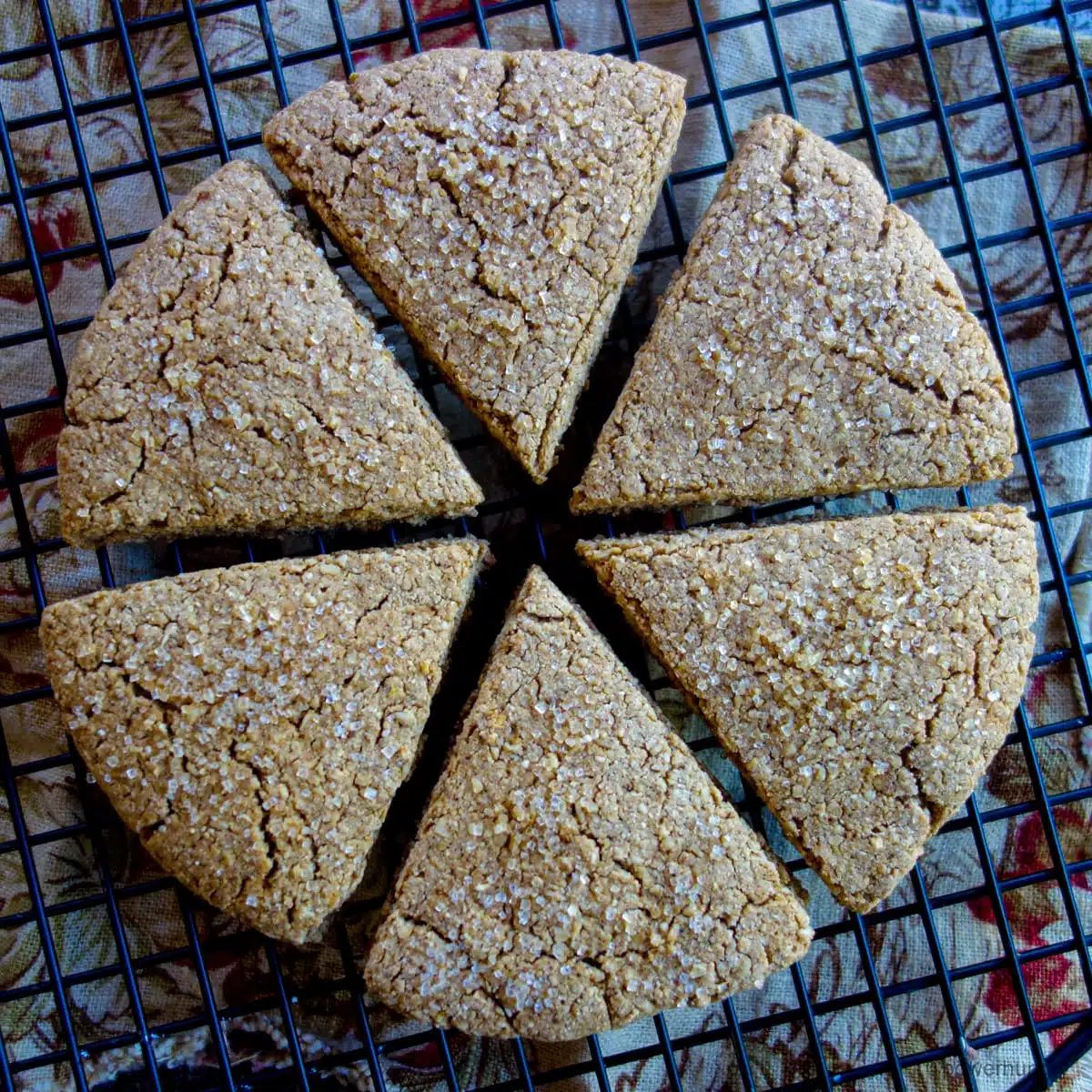 gingerbread wedge scones on a black cooling rack