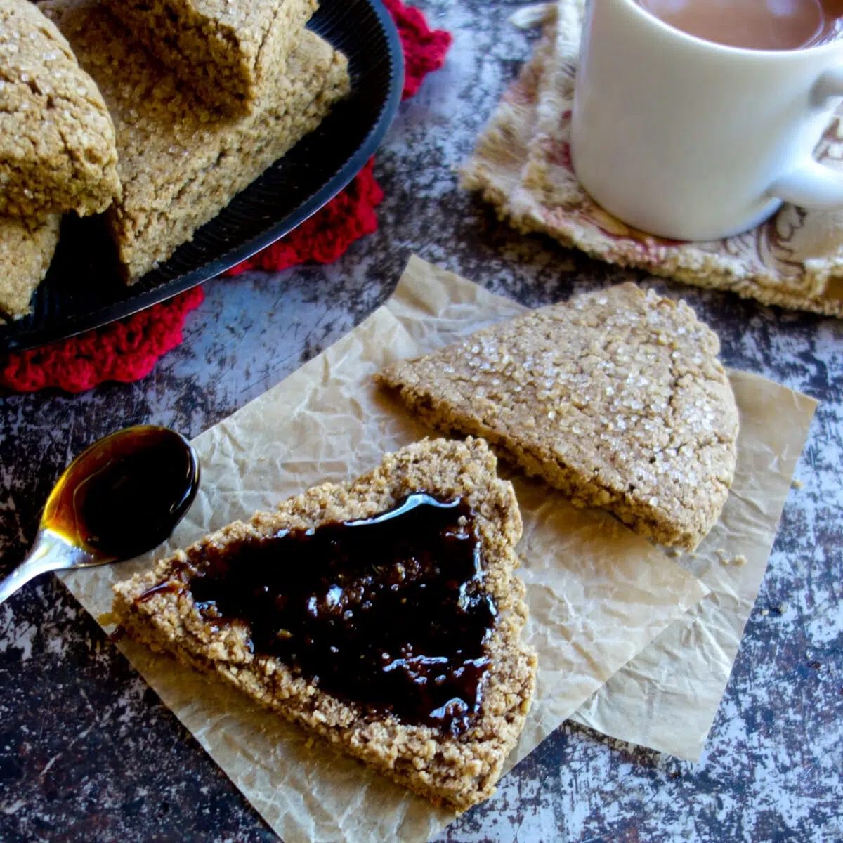 a split gingerbread scone topped with apple syrup