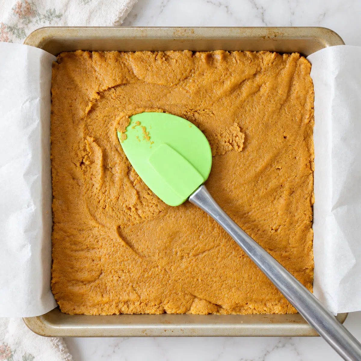 vegan pumpkin pie bars in a baking pan